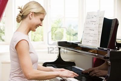 woman smiling photo: Woman playing piano and smiling 3484588-woman-playing-piano-and-smiling.jpg
