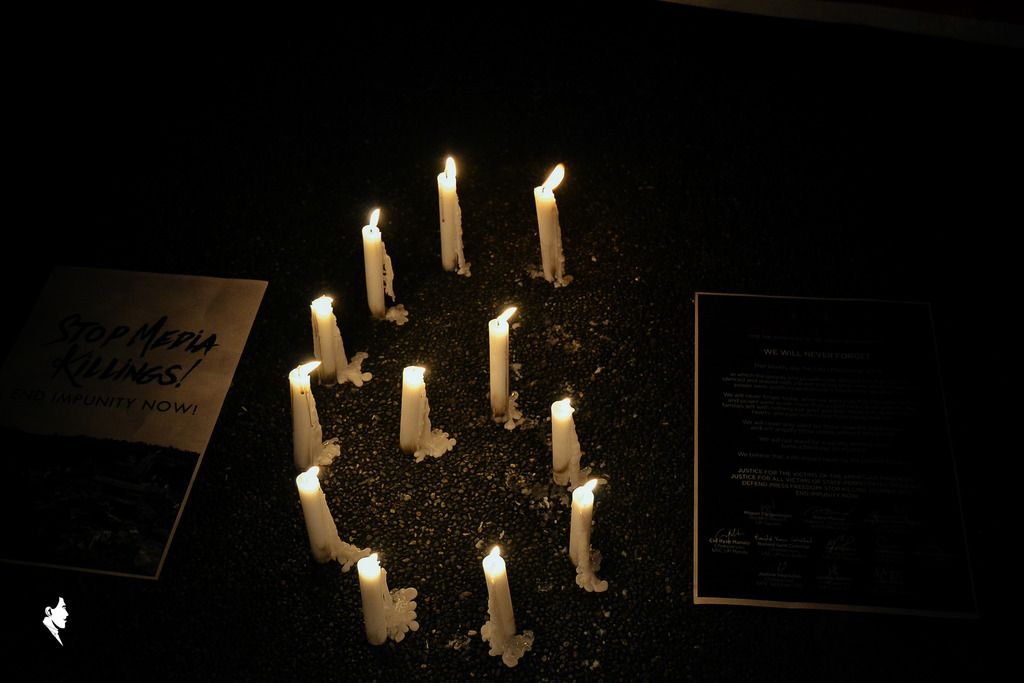 Candles were set alight at the silent protest commemorating the sixth year anniversary of the Ampatuan Massacre at the Oblation Plaza in the University of the Philippines Diliman last September 23. Photo by Raiza Javier.